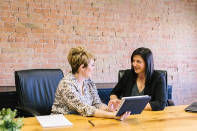 Business persons signing a factoring agreement